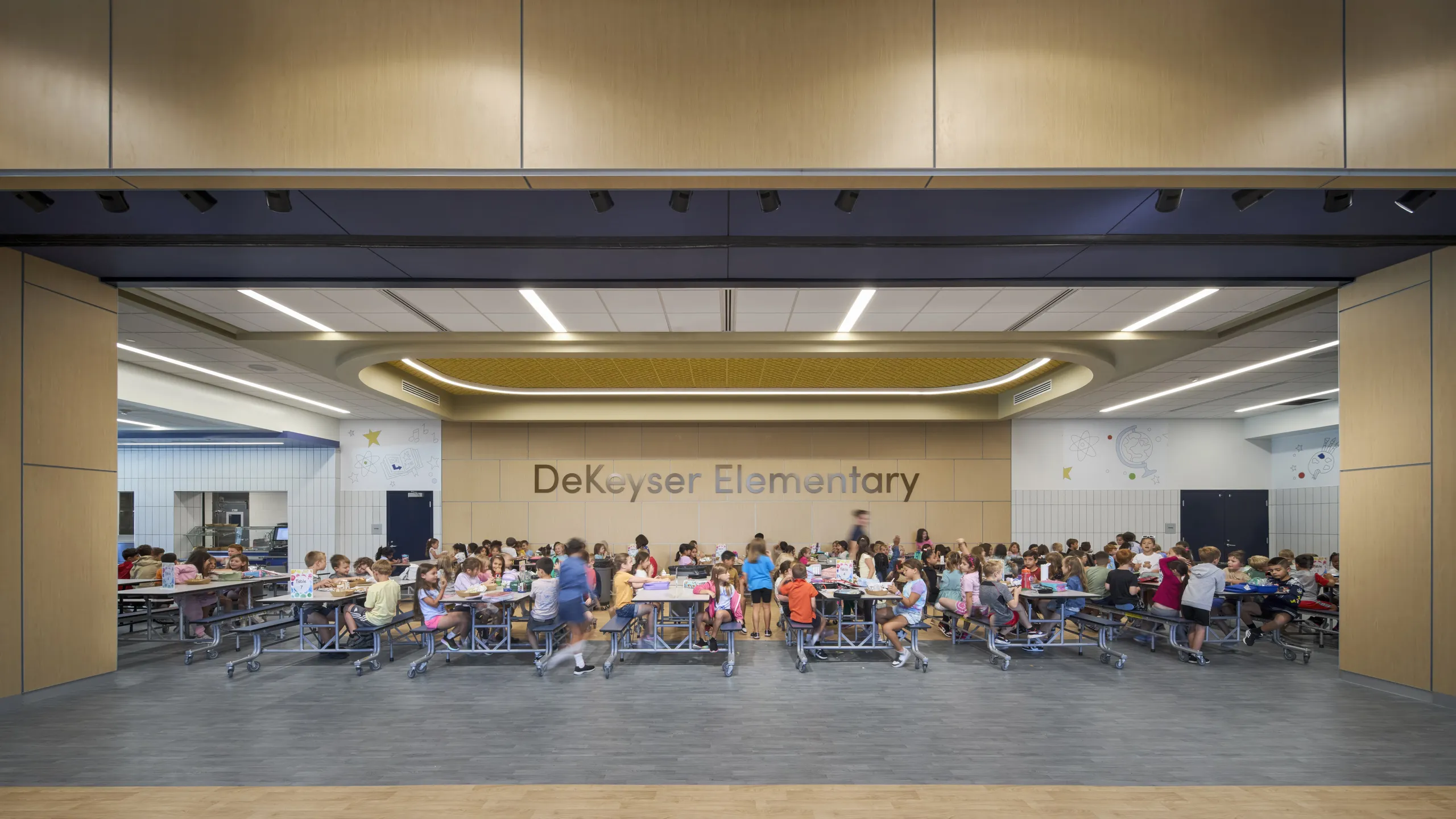 Students eating lunch together in a bright and spacious DeKeyser Elementary School cafeteria